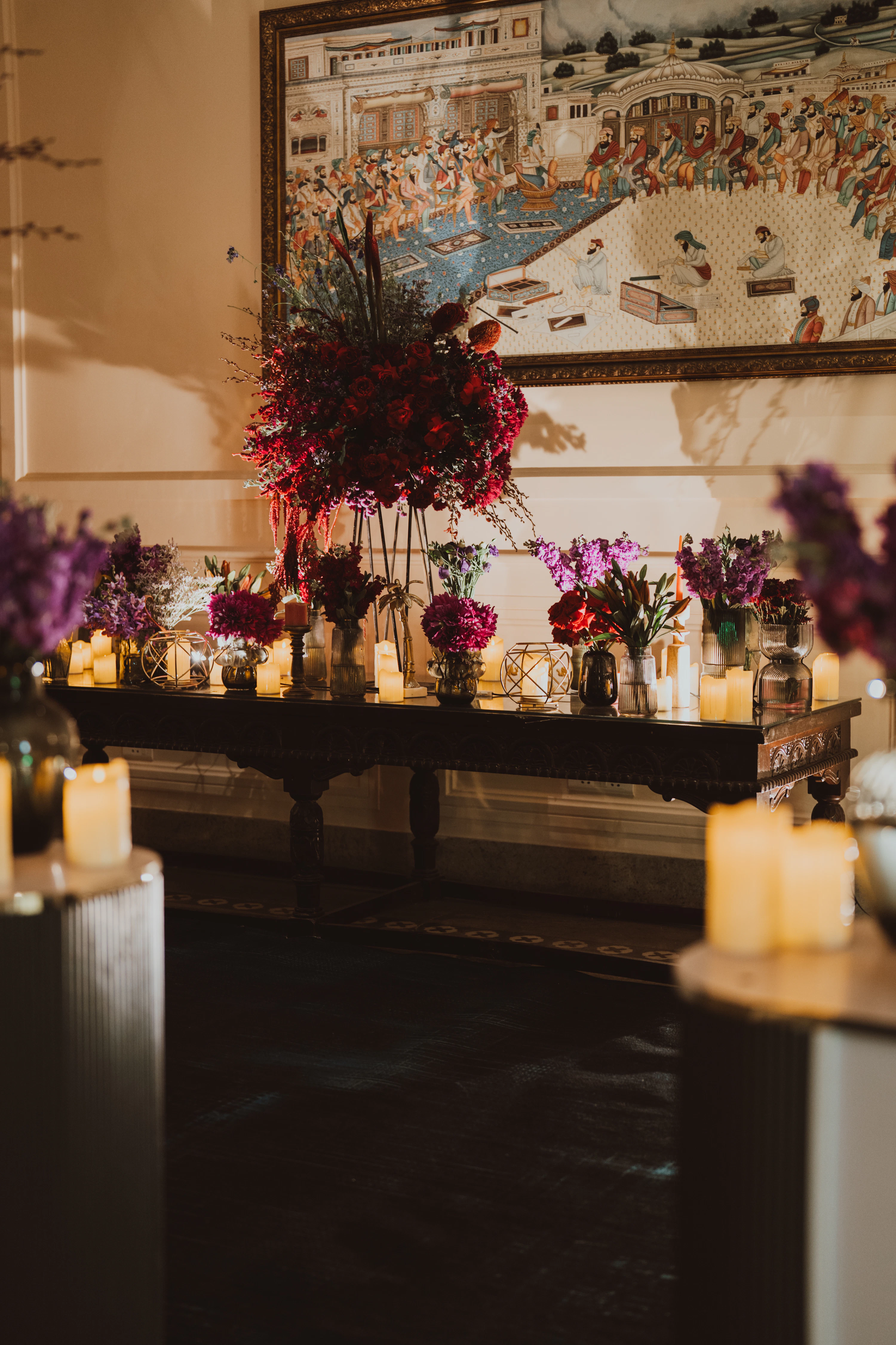 An elegant long table adorned with simple floral arrangements
