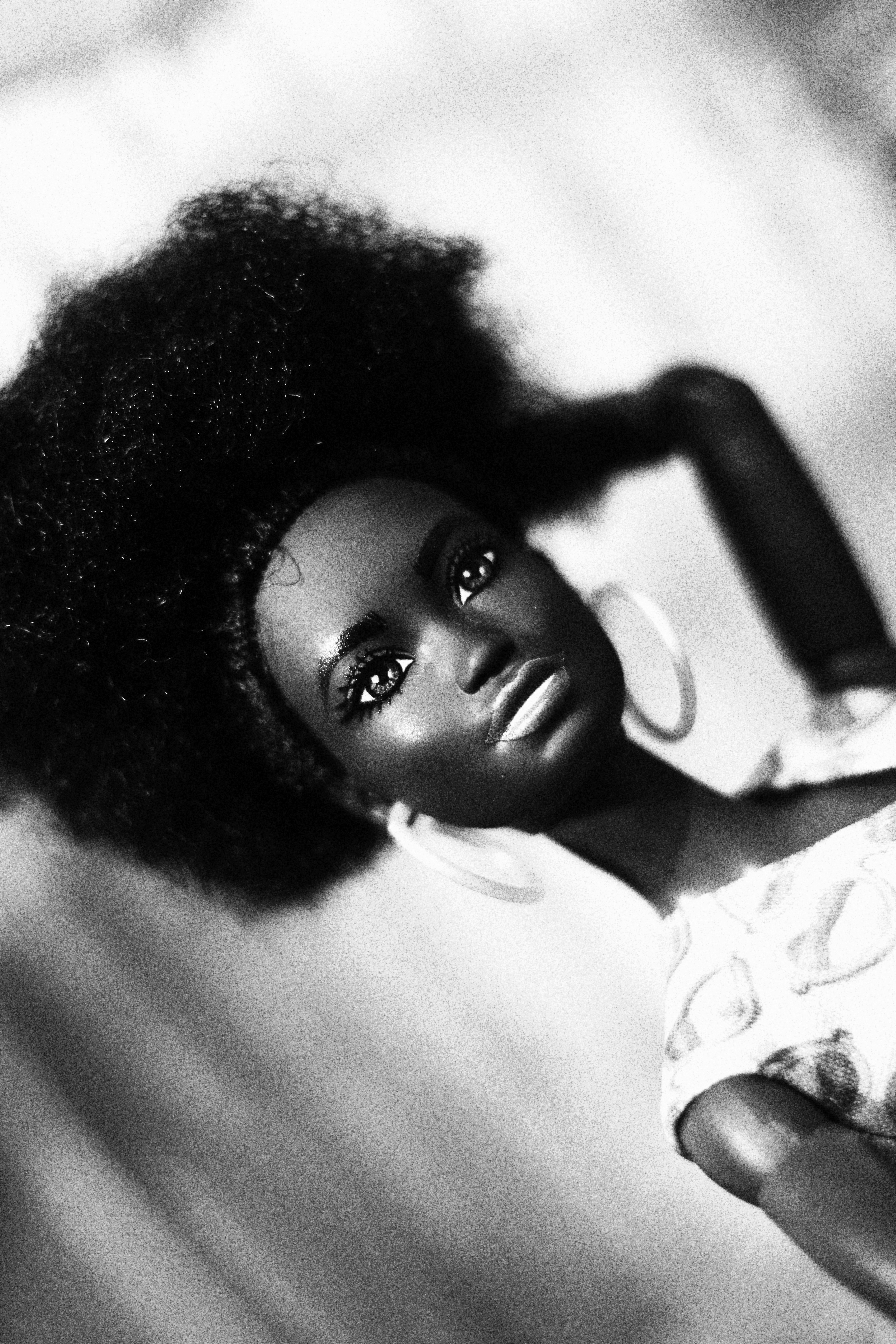A barbie doll strikes a glamorous pose.