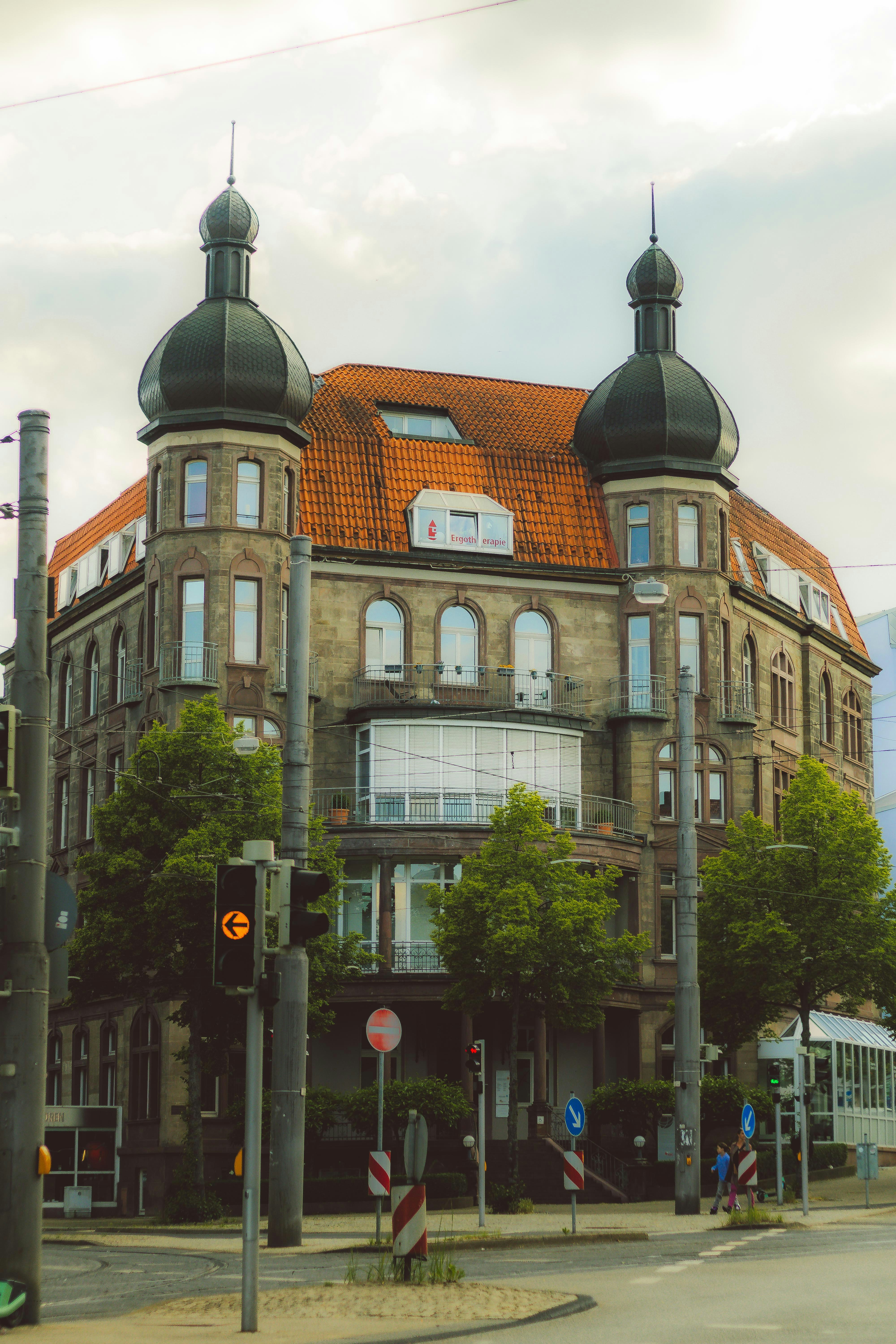 Ornate building with twin black dome turrets.