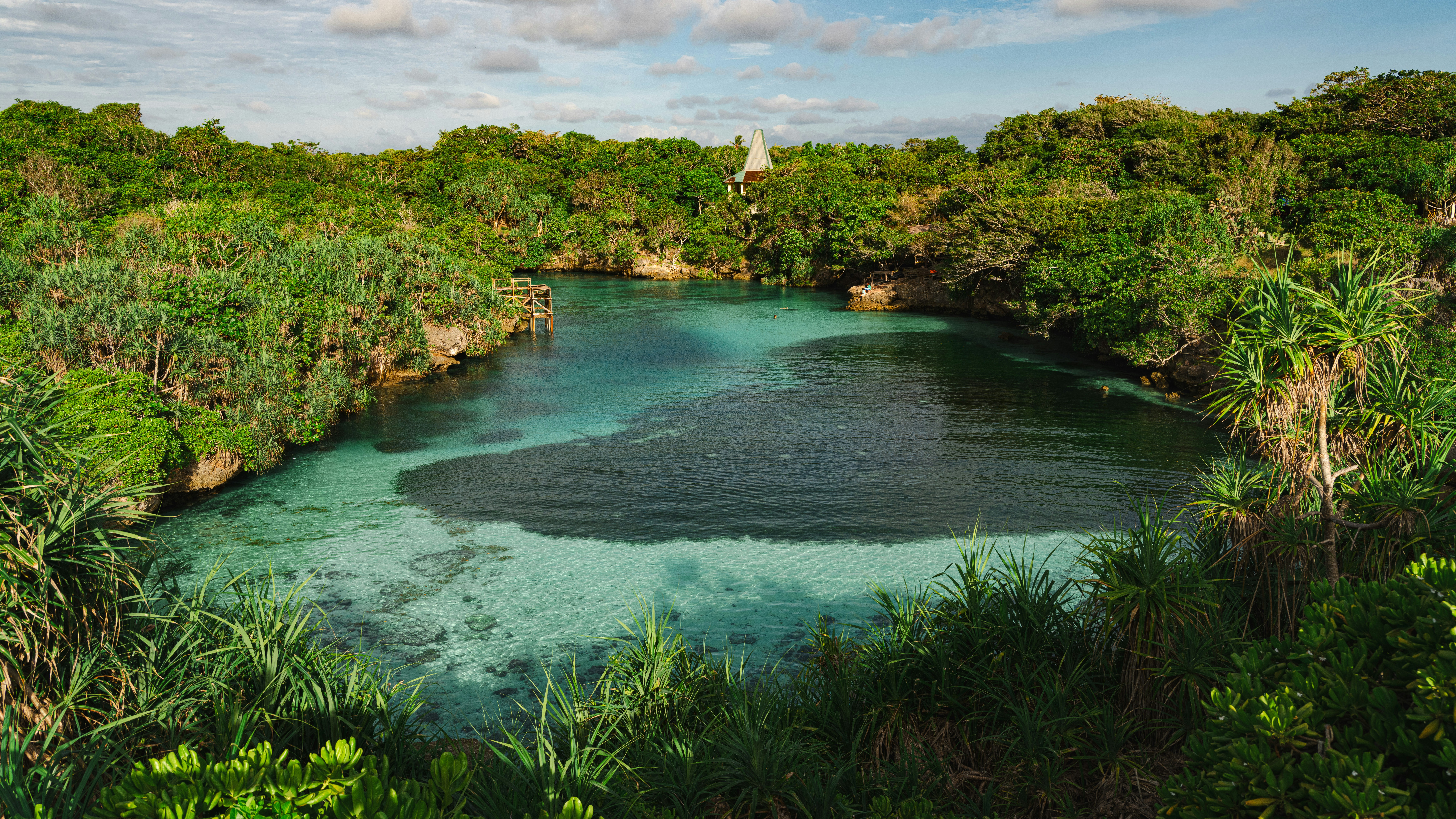 A beautiful lagoon surrounded by greenery.