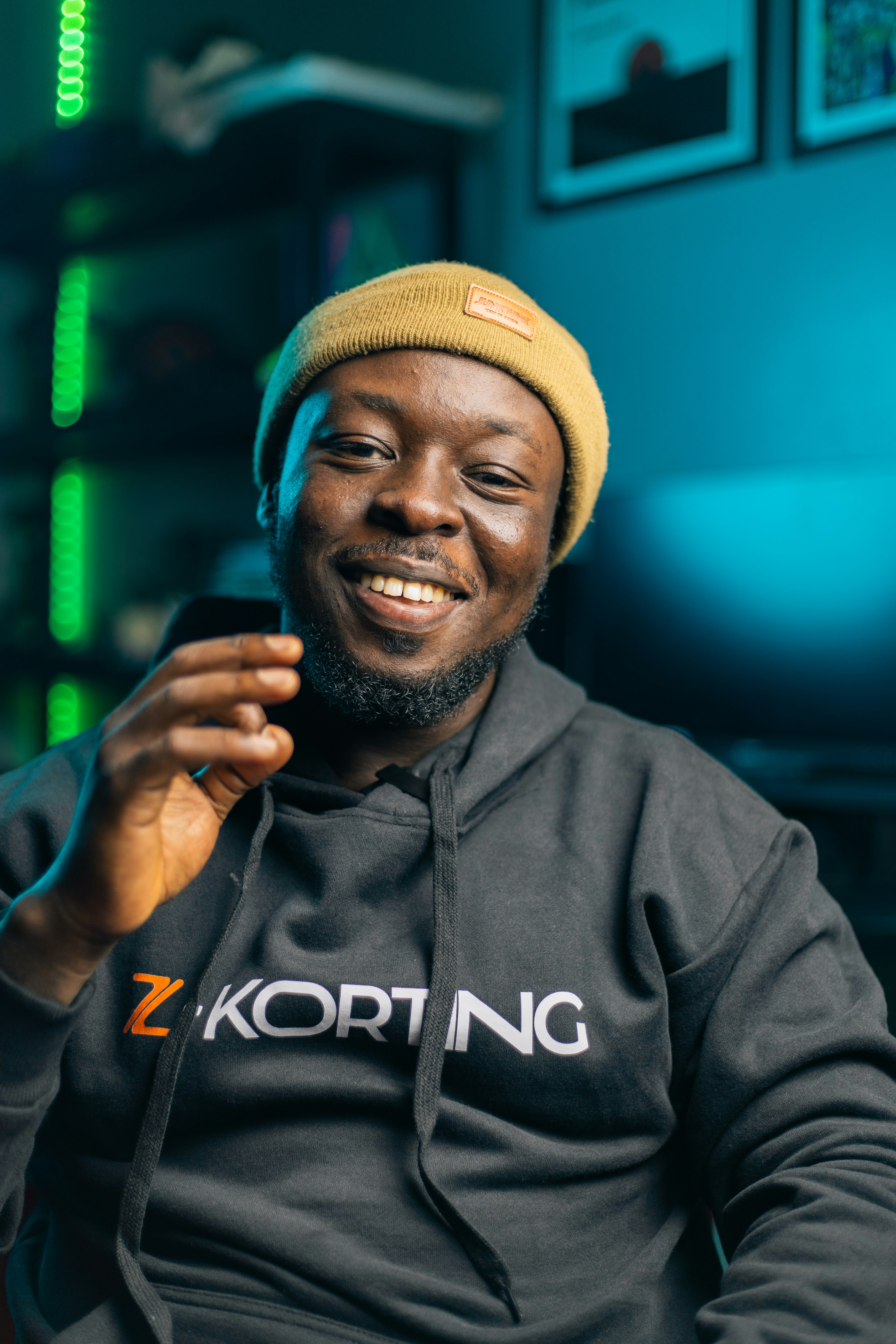 Happy man smiling in a studio.
