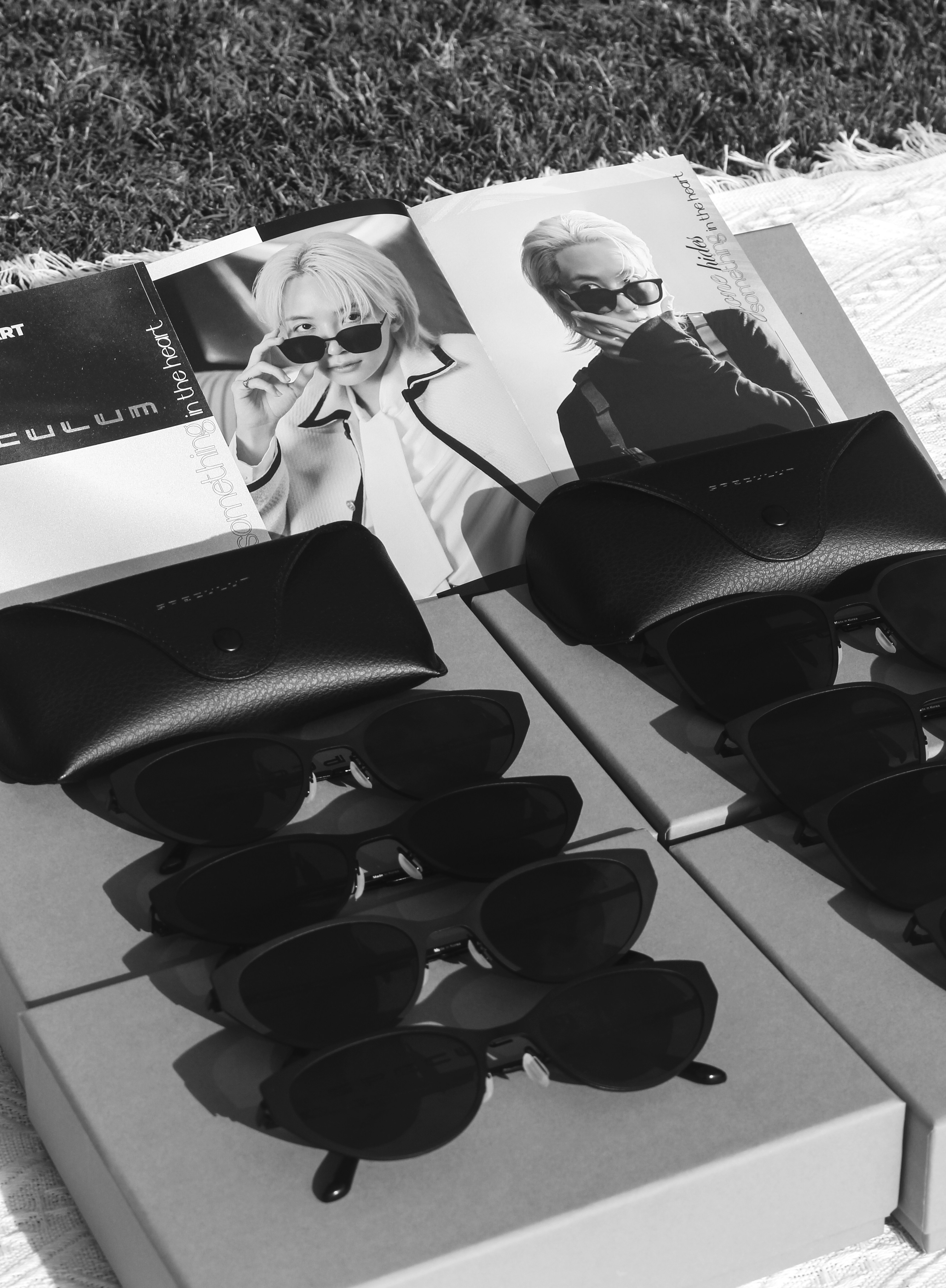 Sunglasses and promotional materials are neatly arranged.