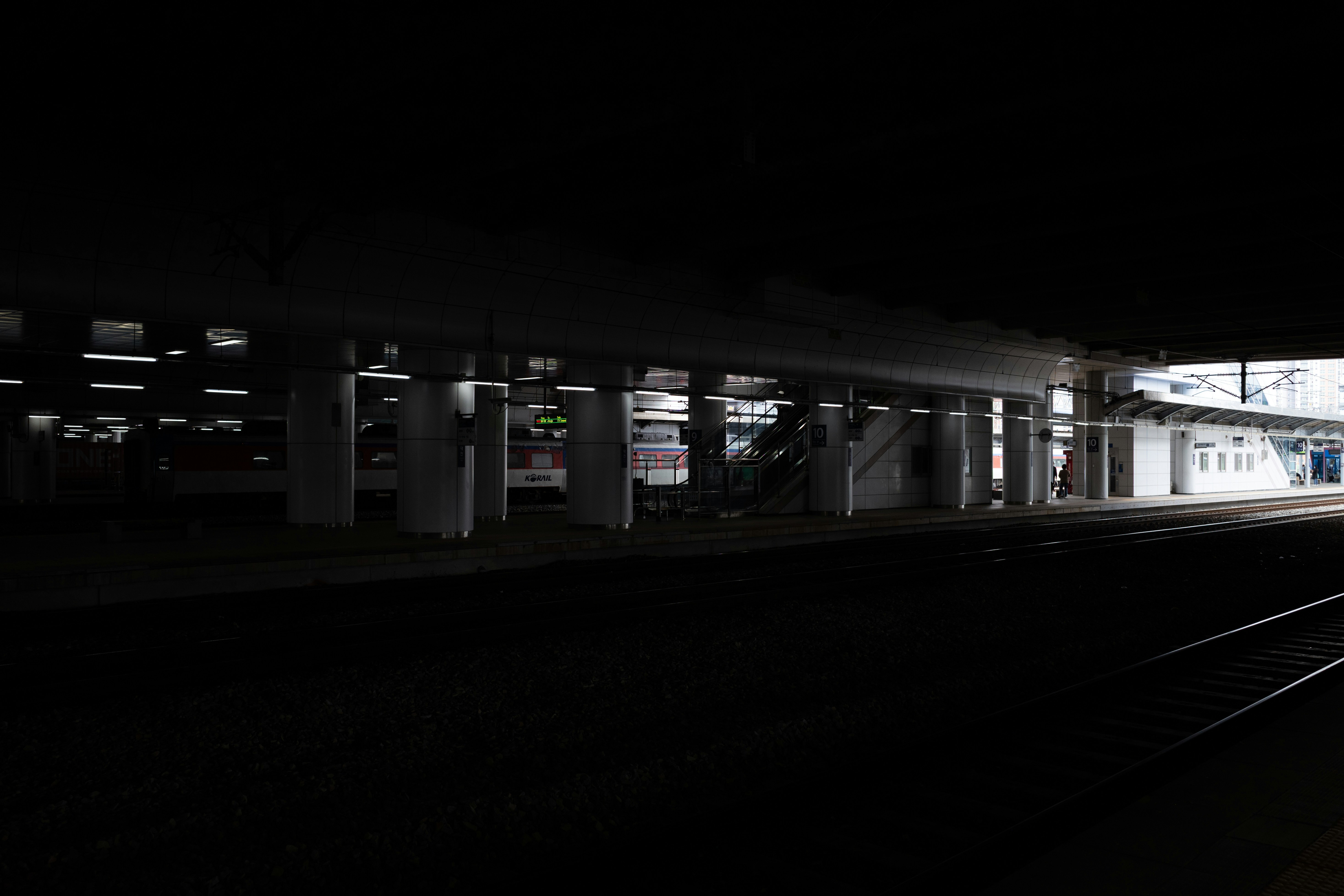 Closeup of an electric car charging port plugged in at night