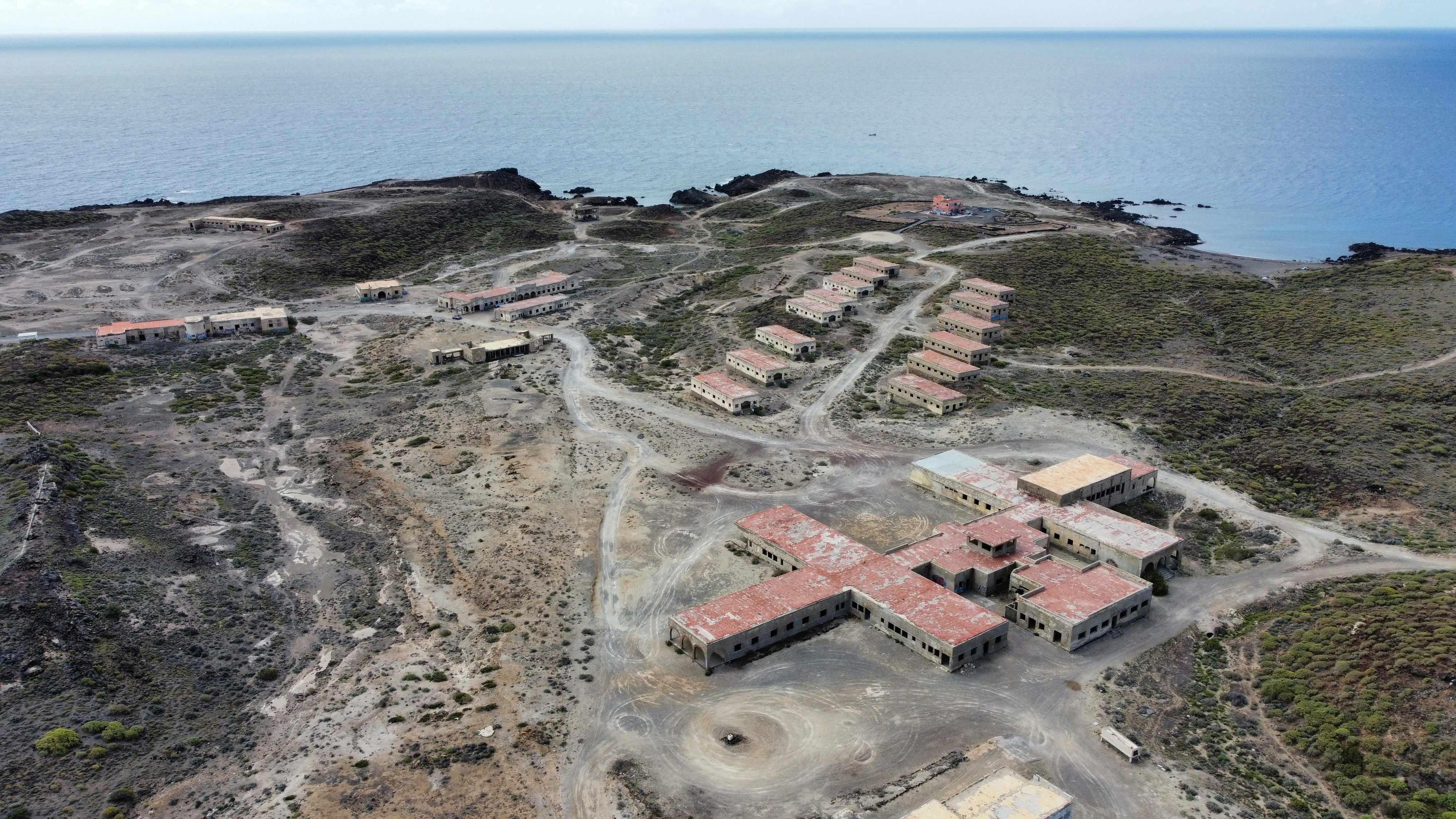 Aerial view of buildings near the sea.