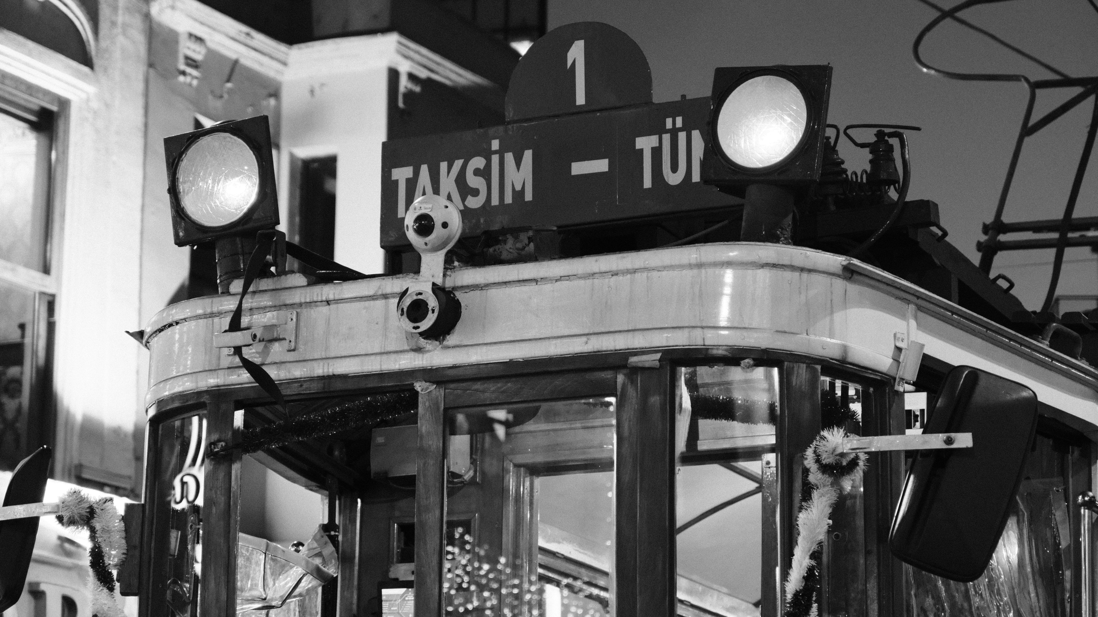 A vintage tram in black and white.