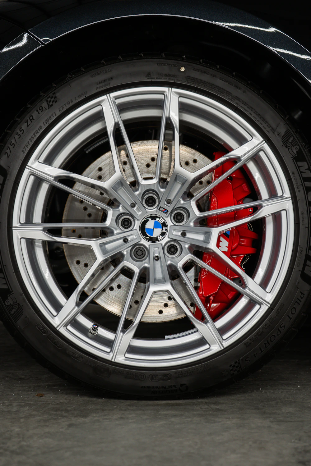 BMW alloy wheel, Michelin tyre and red brake caliper
