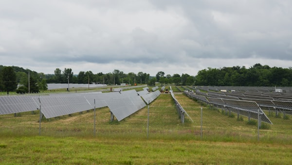 Solar panels generating energy in a field