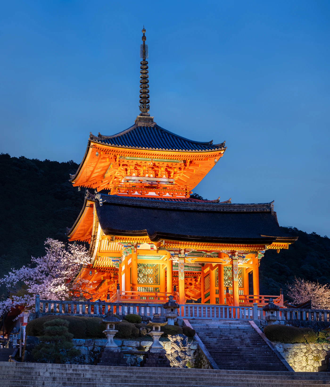 Warmly lit traditional temple in Kyoto at dusk