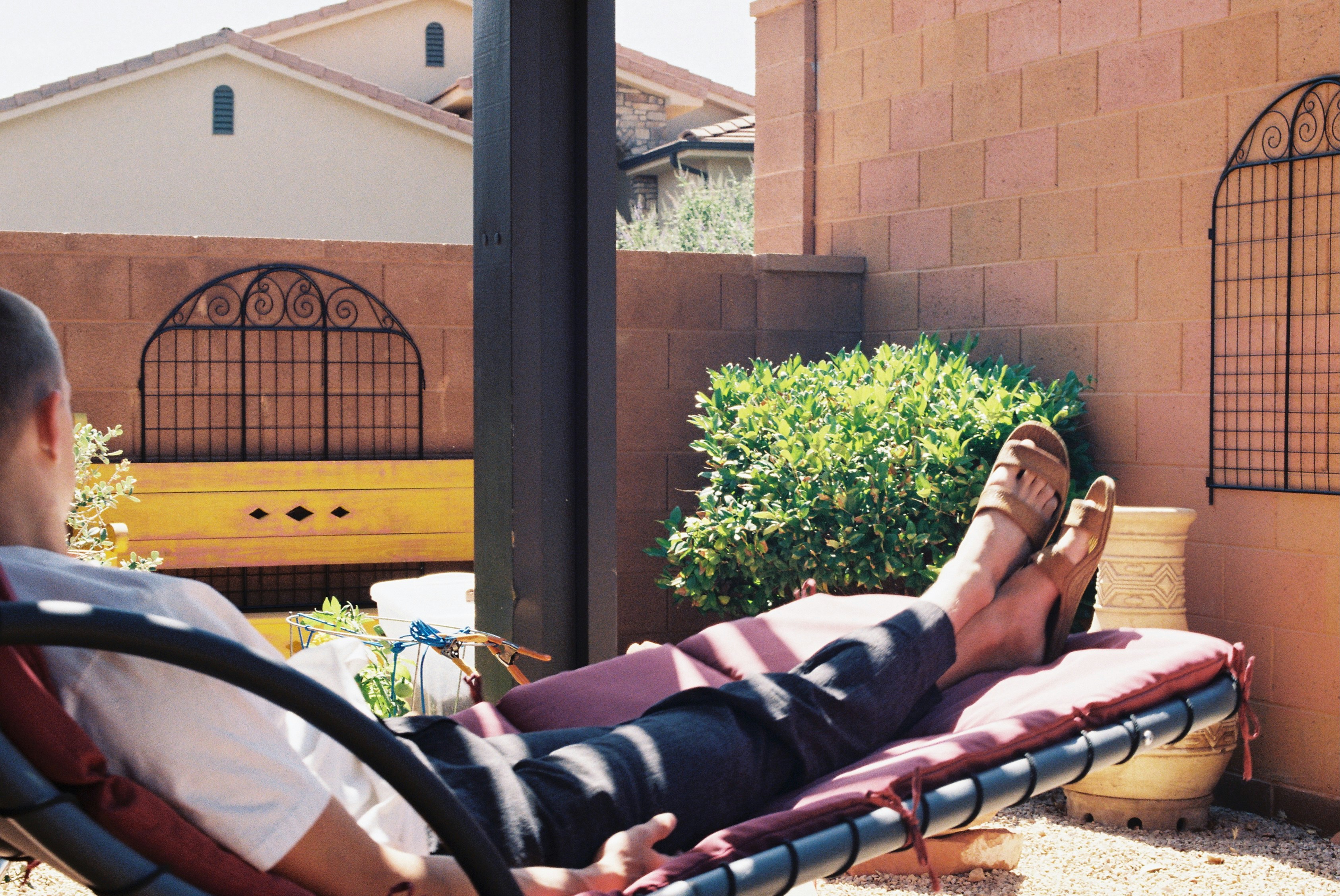 Person relaxing in the sun on a lounge chair. photo – Free Man Image on ...