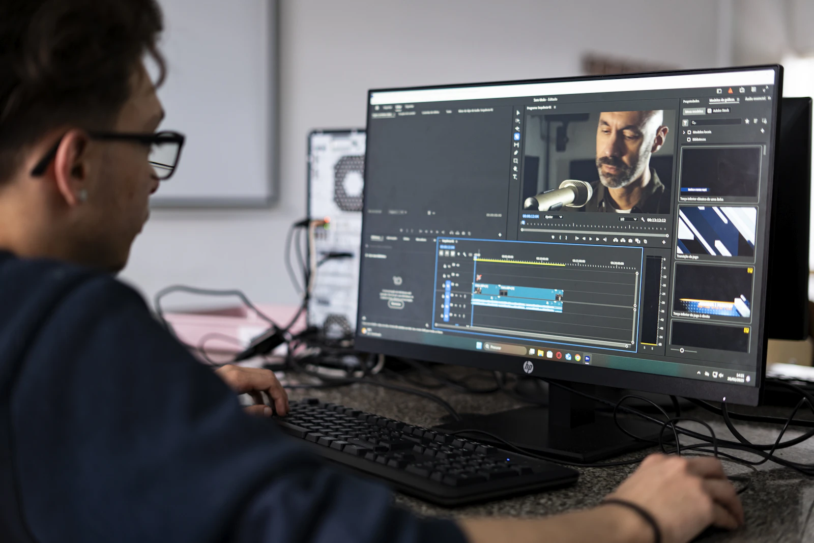 A video editor reviewing footage during post-production on a desktop computer