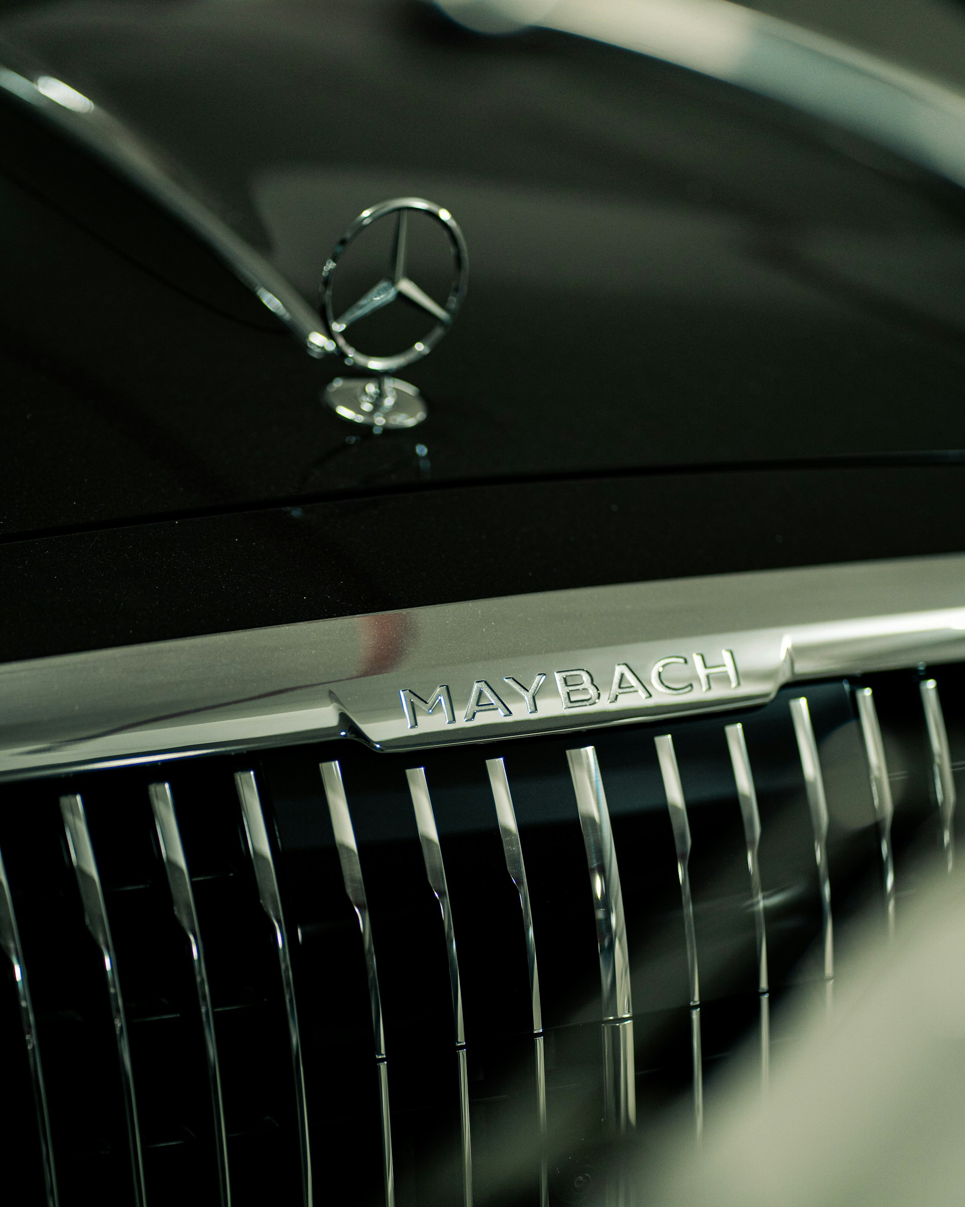 A close-up of a maybach's hood and grill.