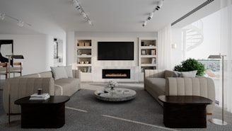 Modern living room with couches and fireplace.