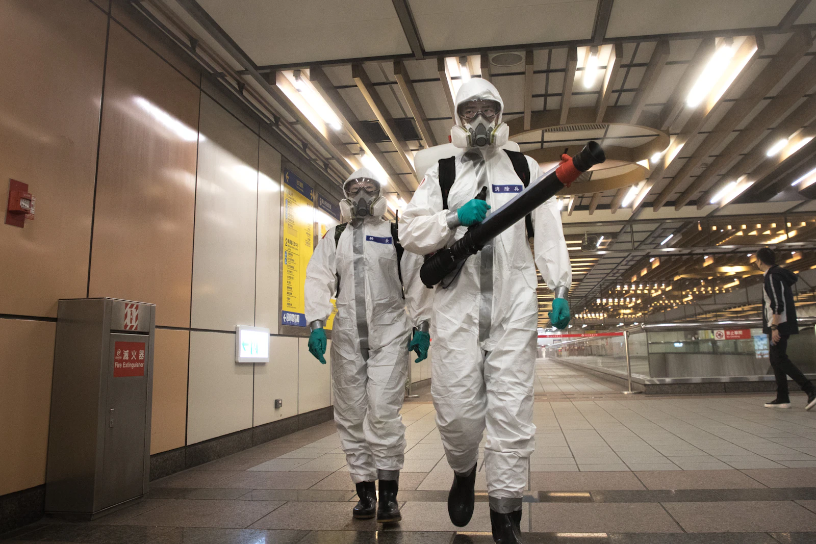 KAVACH crew in protective suits treating a commercial space