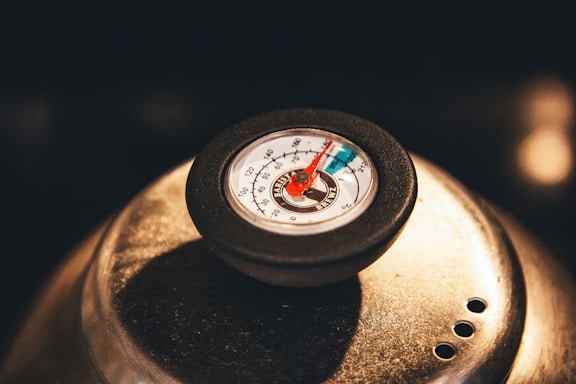 The thermometer shows a high temperature reading.