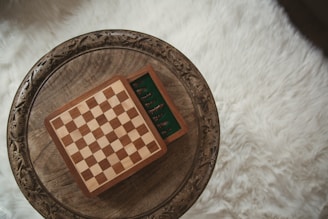 A small chess set sits open on a table.
