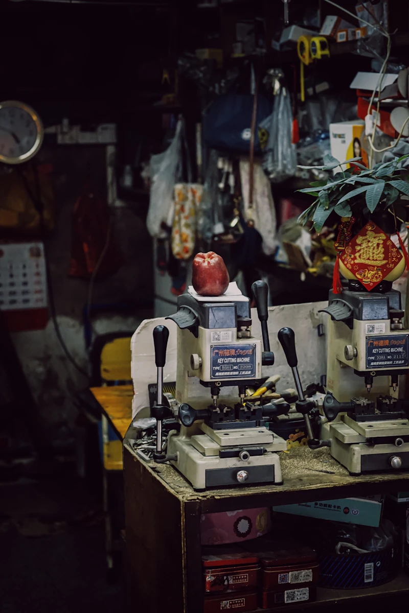 Locksmith workshop with key cutting machines and brass blanks