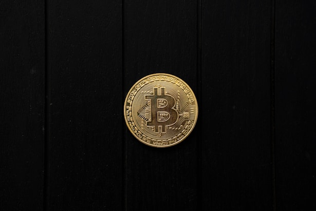 Bitcoin coin isolated on a black background.