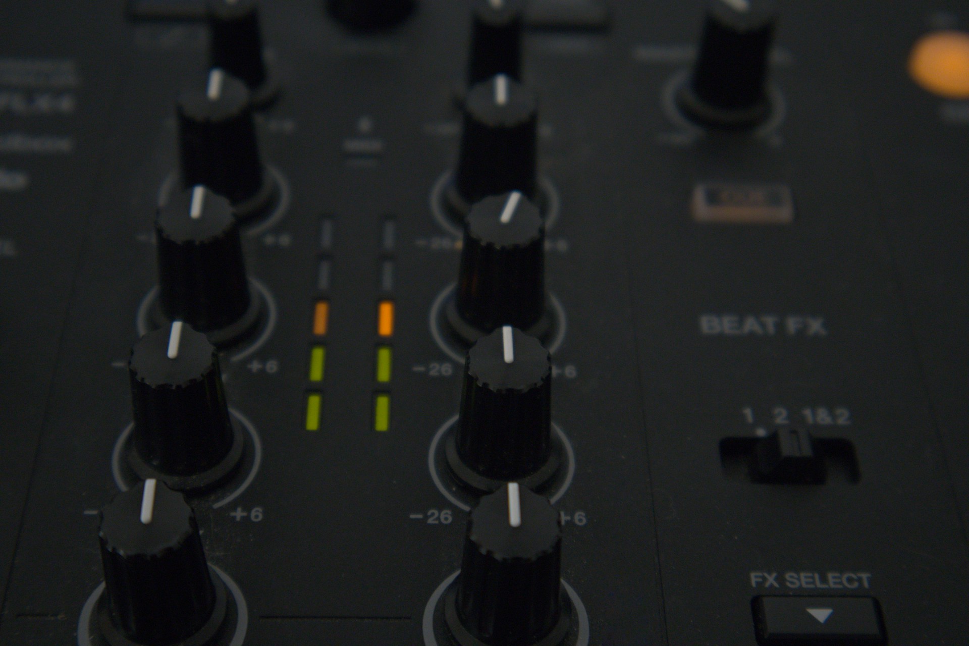A dj mixer is shown with various controls.
