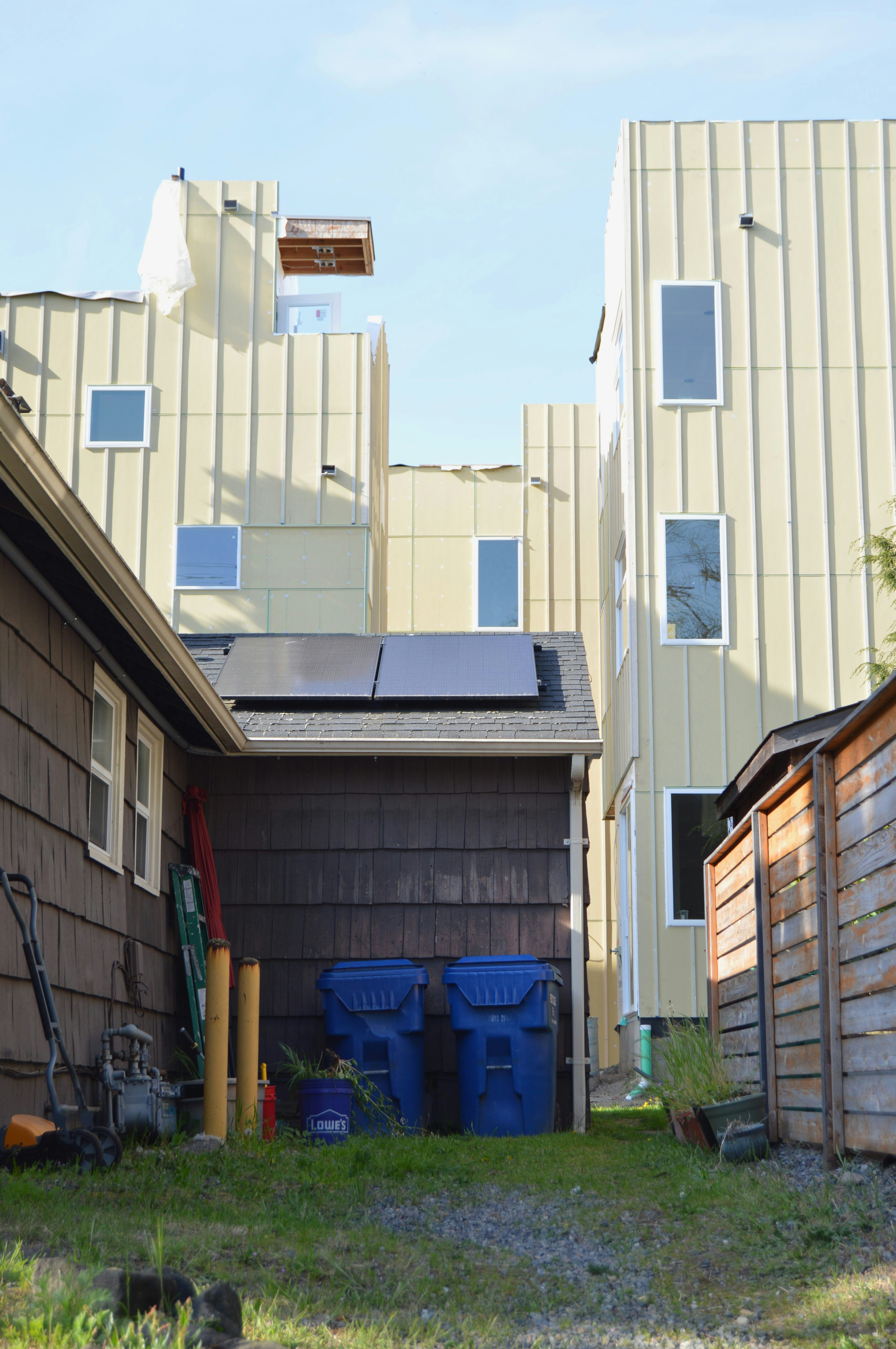 Houses juxtapose, with old and new architecture.