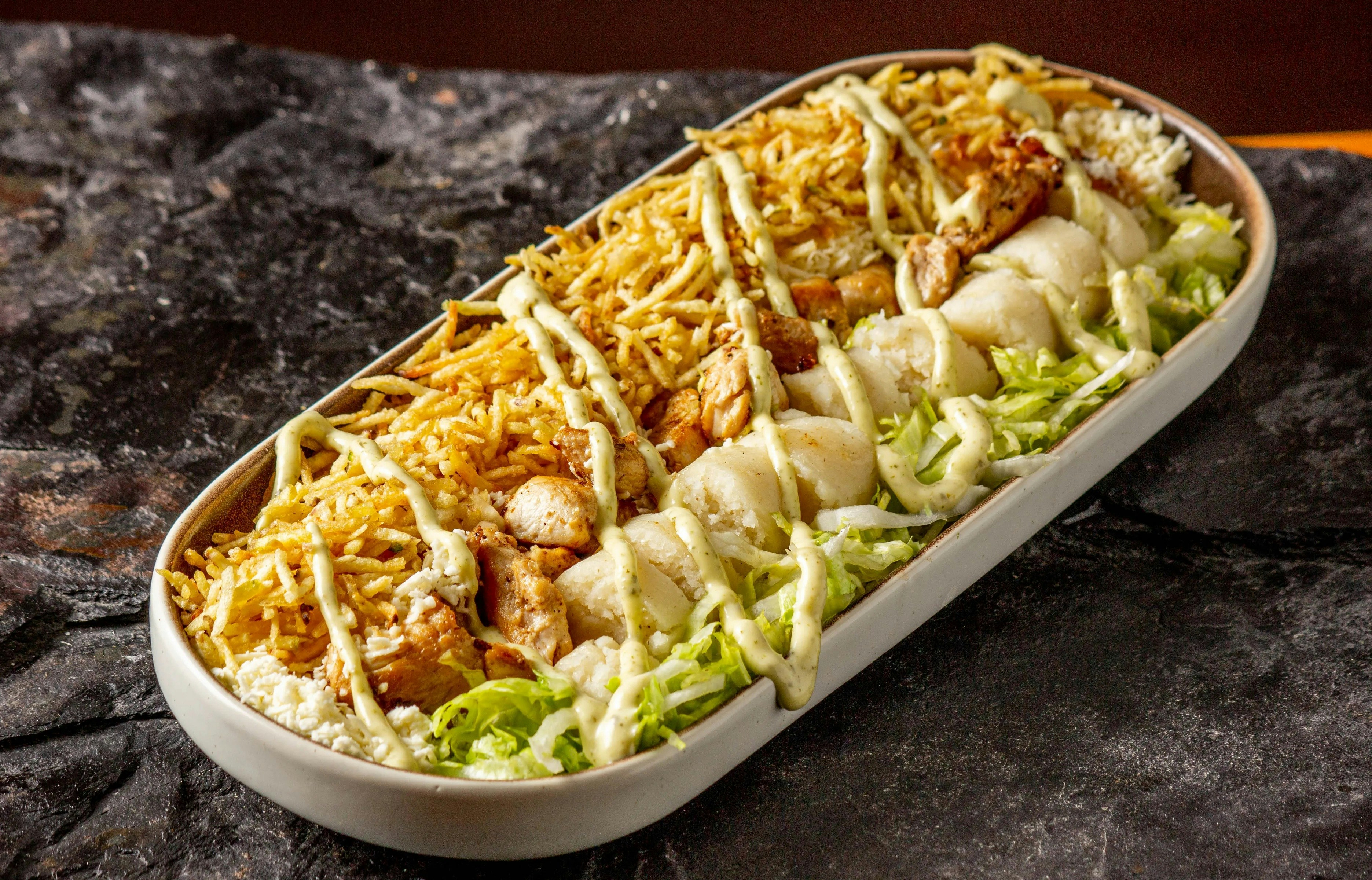 Enchiladas with toppings in a dish