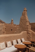 Terrace seating overlooks an ancient, earthen structure.