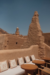 Terrace seating overlooks an ancient, earthen structure.