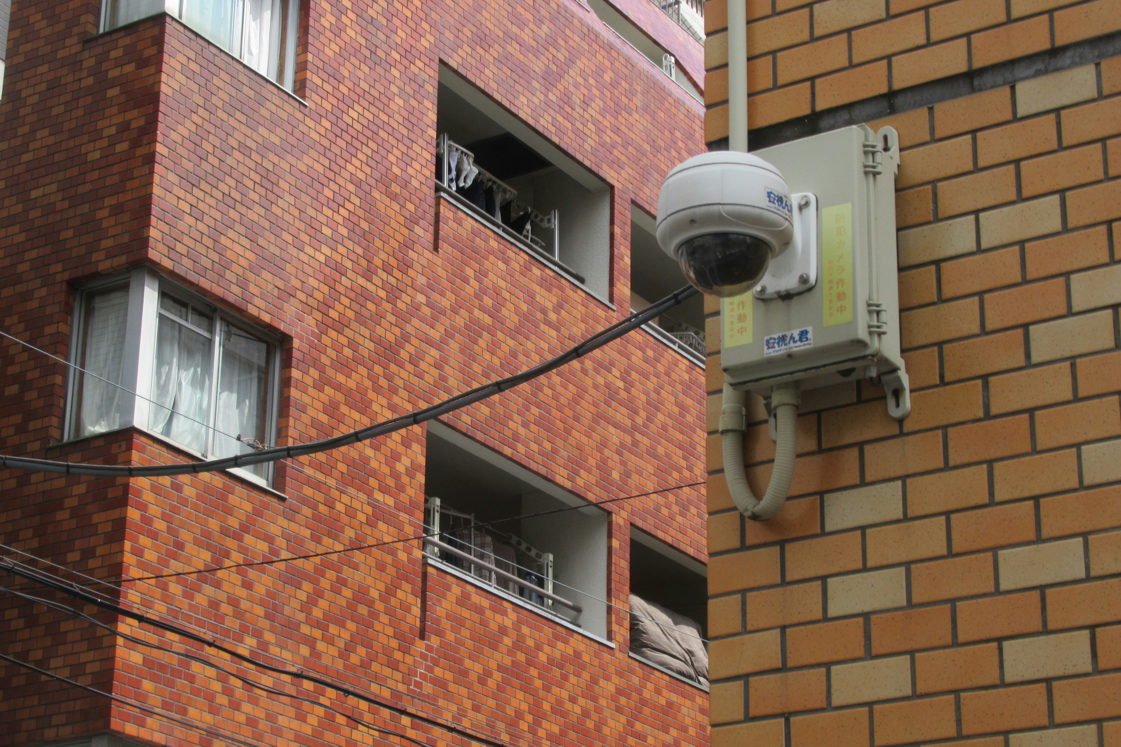 Security camera mounted on a building's exterior