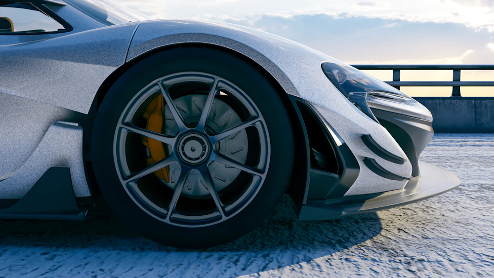 Sports car showing off its custom wheel and low-profile tire