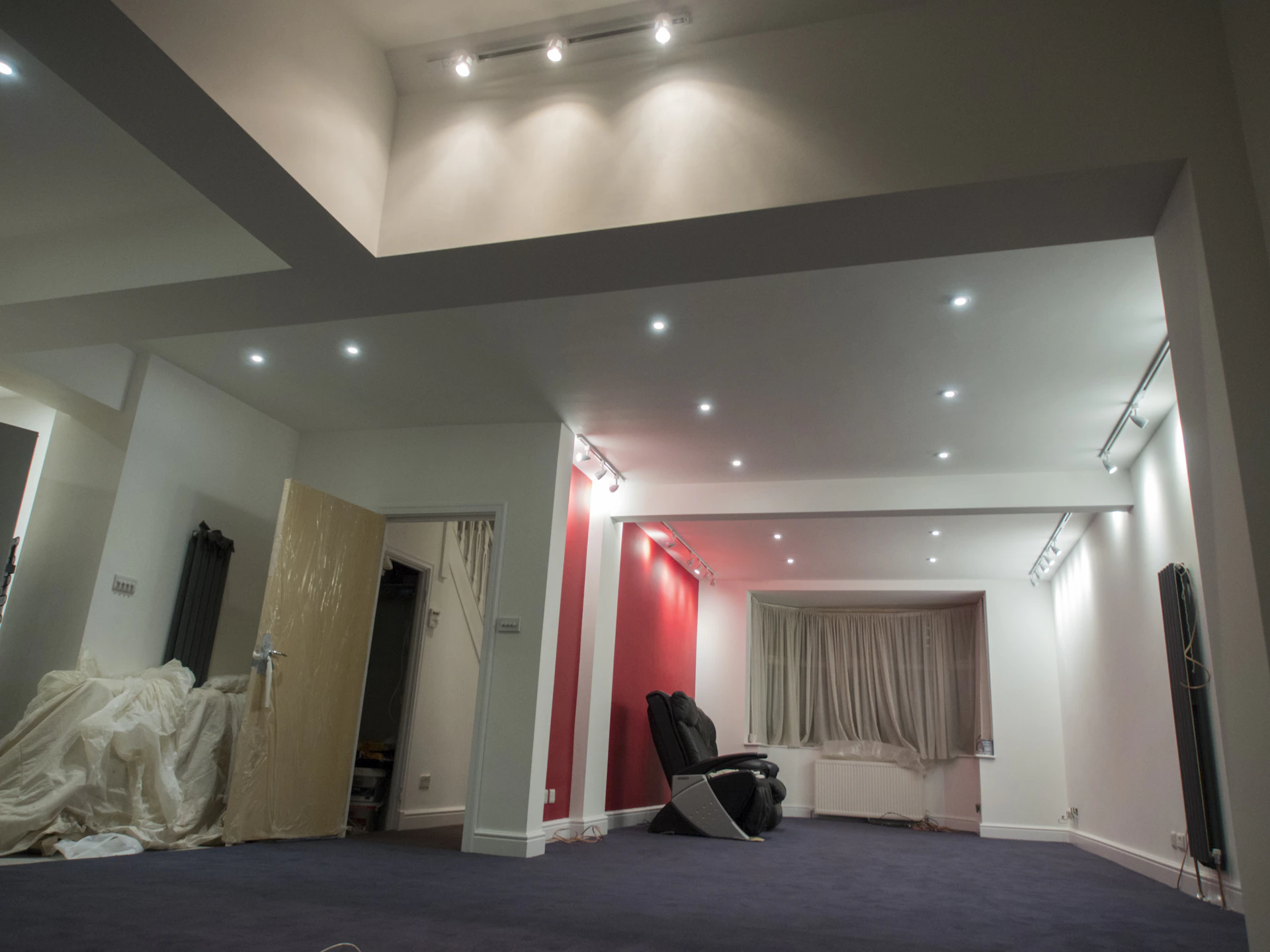 A room with a bright ceiling and lights.