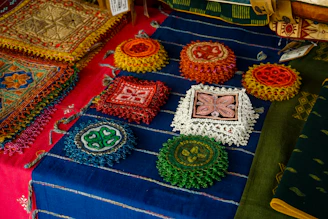 Handmade crafts are displayed on a table.