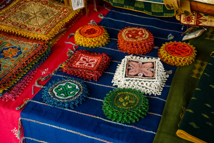 Handmade crafts are displayed on a table.