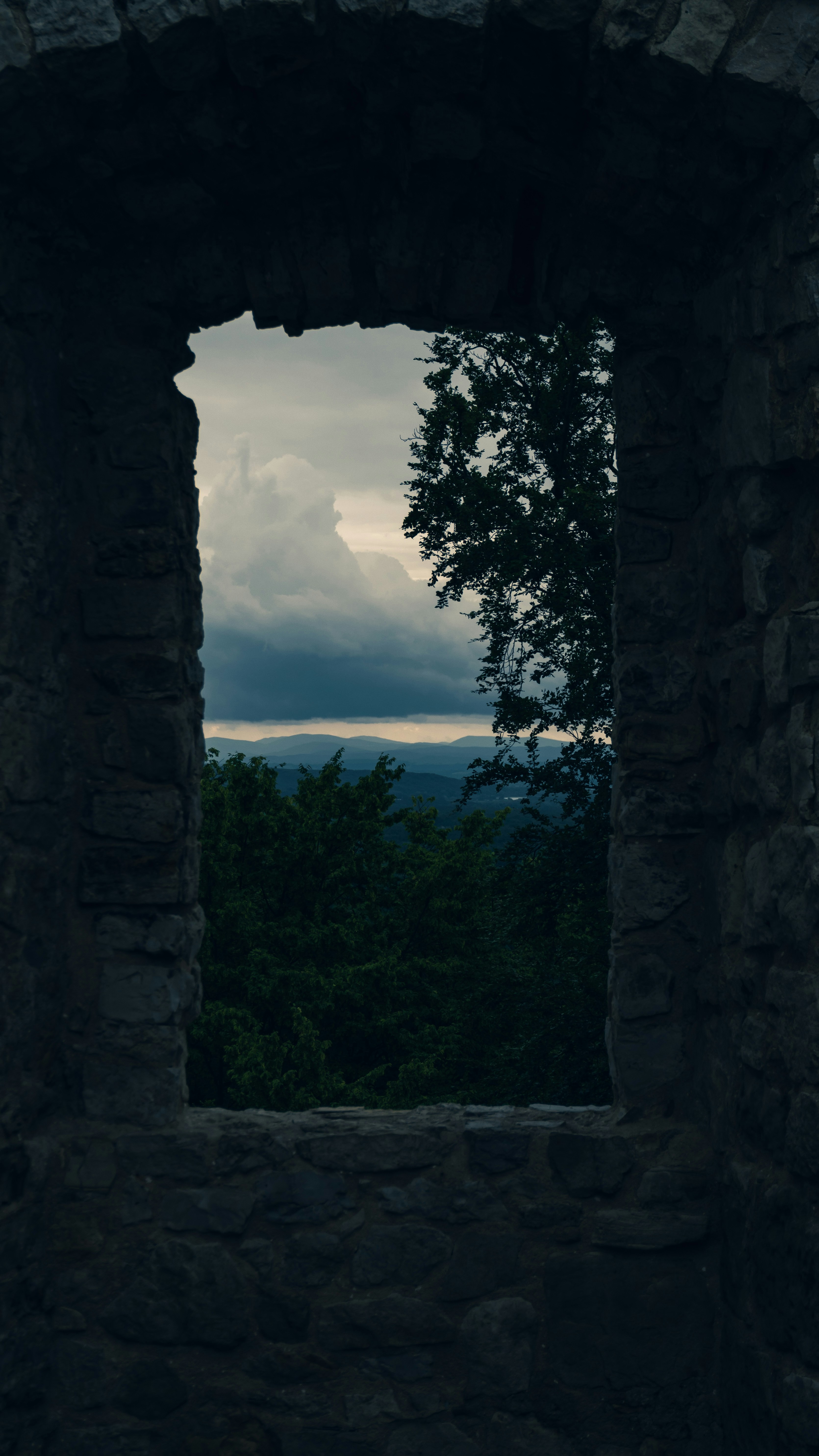 View of landscape through a stone window.