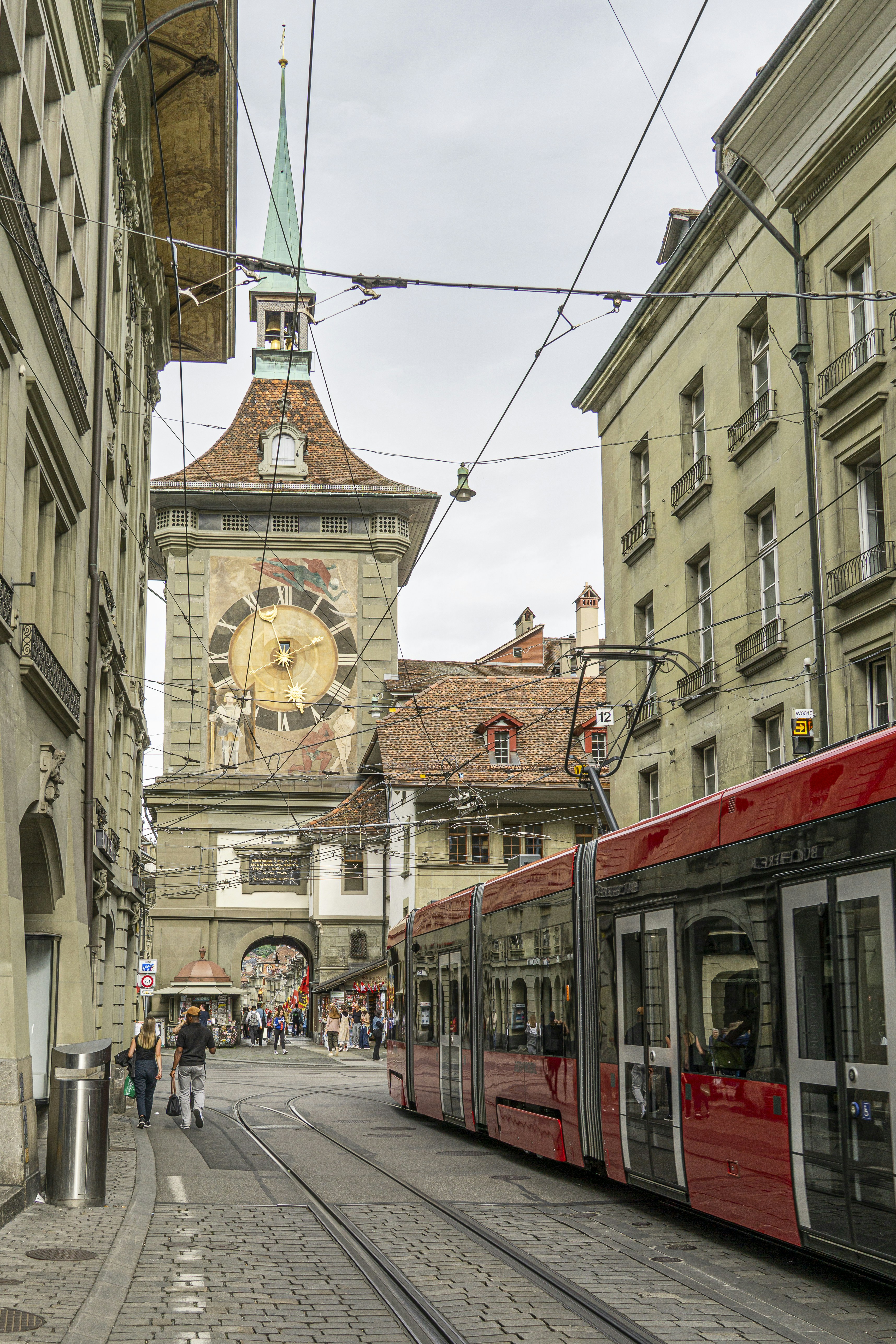 The zytglogge clock tower and a tram in bern, switzerland.