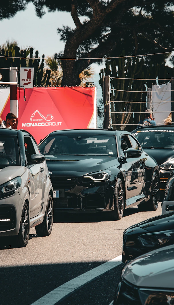 Cars in a line at monaco circuit.