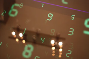 Numbers are reflected on a surface, blurring the image