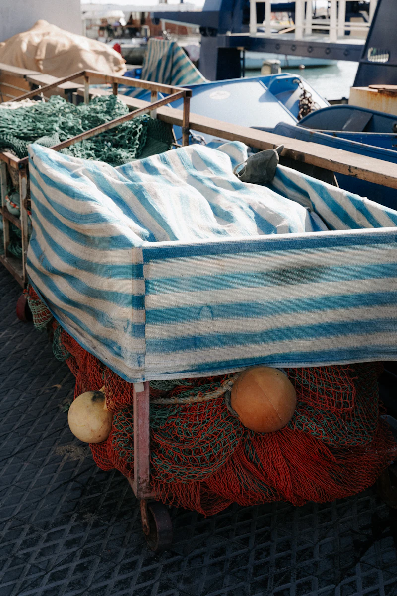 Fishing nets and equipment on a boat deck in saltwater conditions