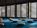 Japanese room with cushions on the floor.
