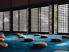 Japanese room with cushions on the floor.