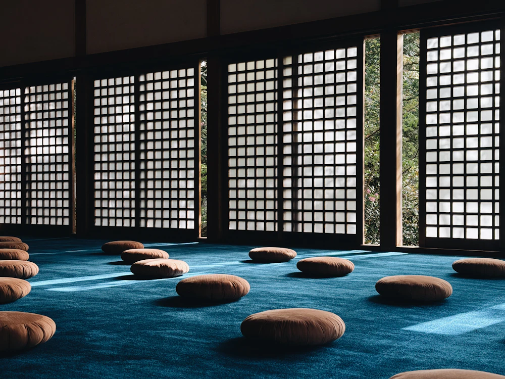 Calm Japanese room with floor cushions and natural materials