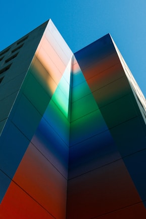 Colorful building with light refractions reaching to the sky.