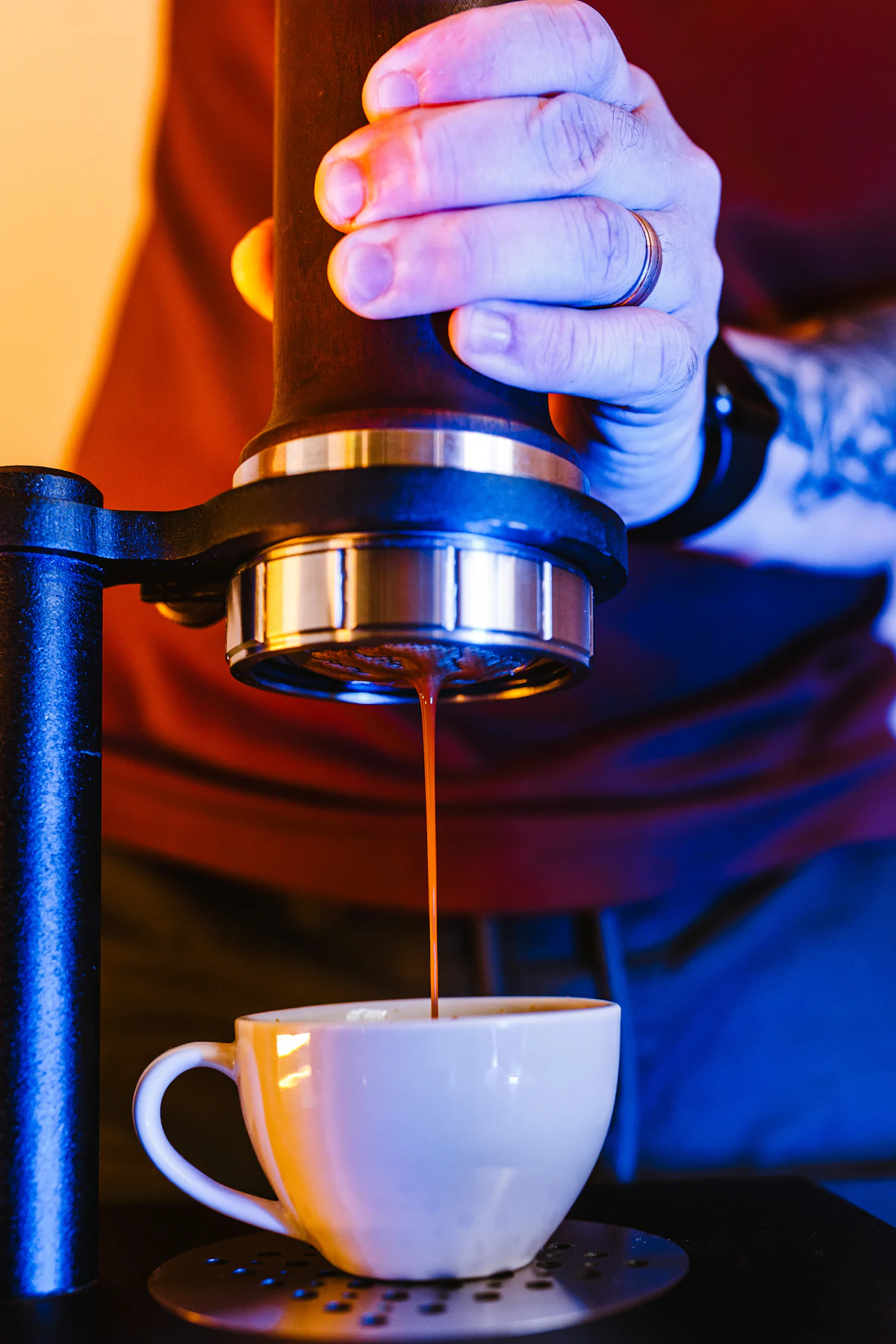 Espresso pouring from a machine into a cup
