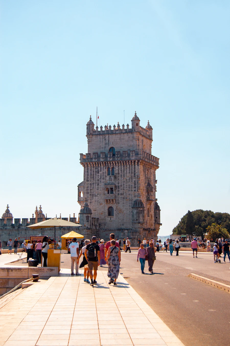 Visitors at Belém Tower on the banks of the Tagus River in Lisbon