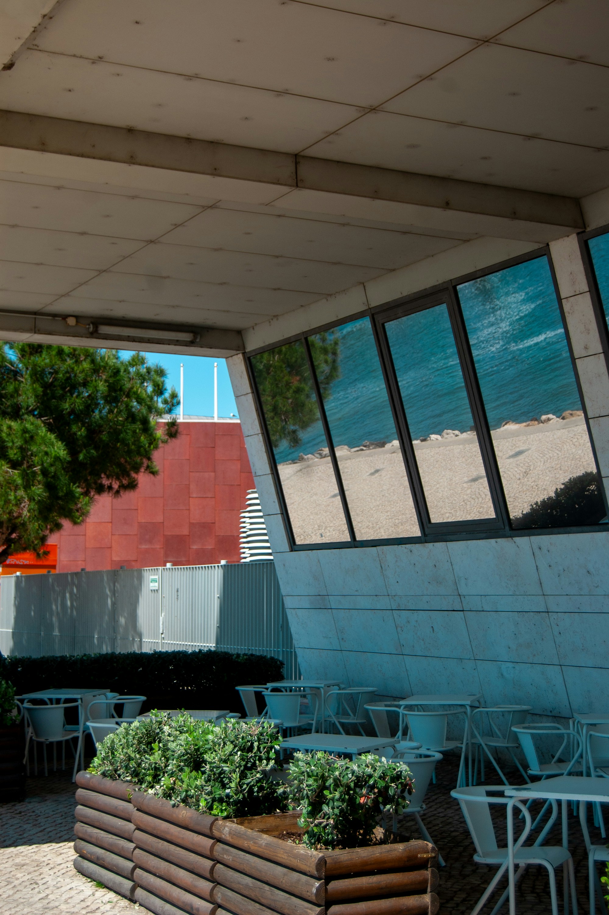 A cafe terrace offers a scenic water view.