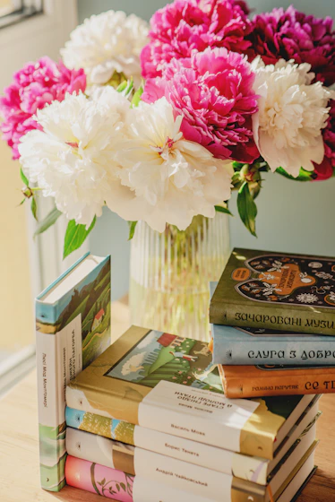 Peonies and books form a beautiful still life