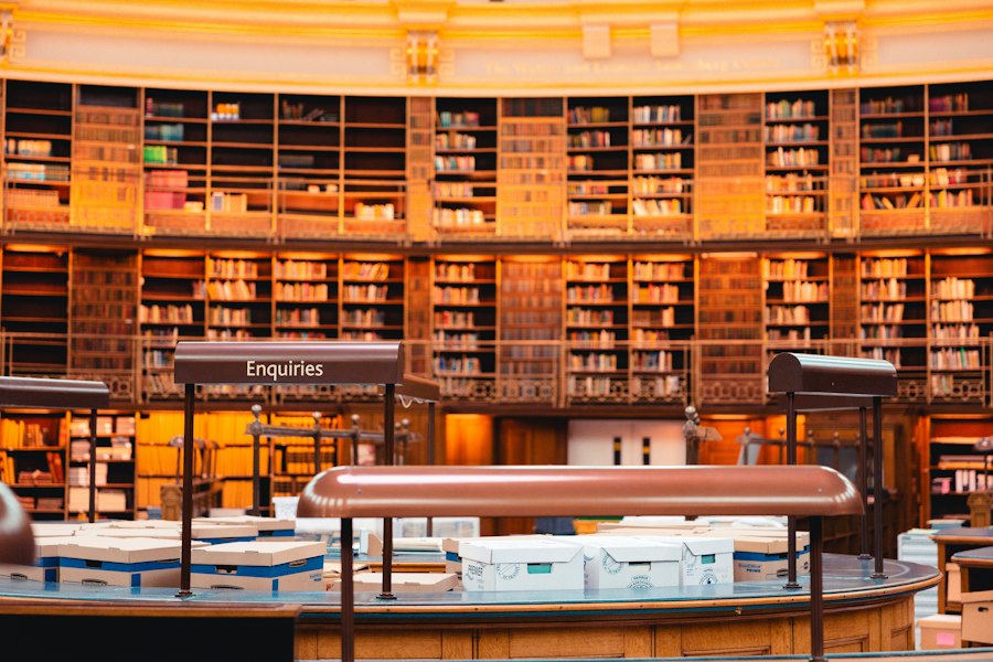Grand library reading room with an enquiries desk