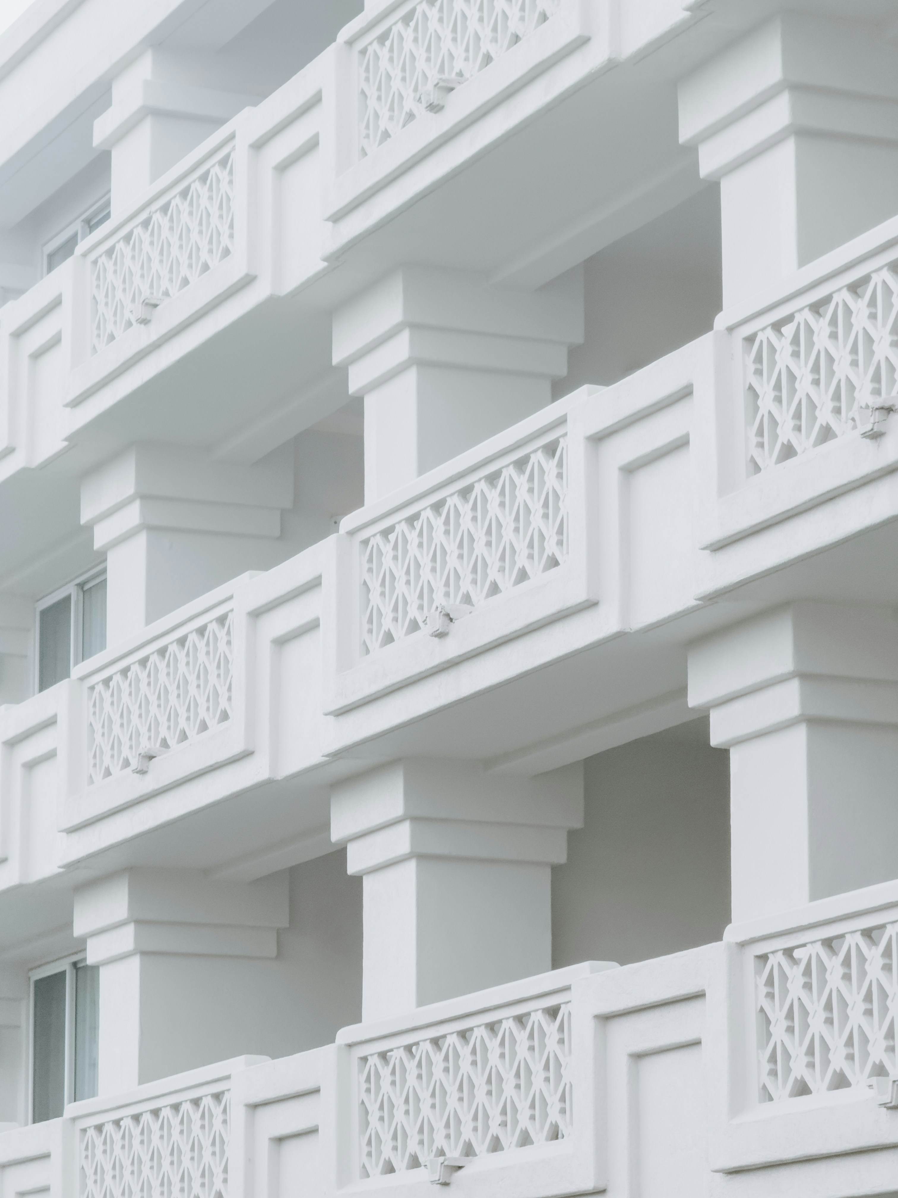 White balconies adorn a building.