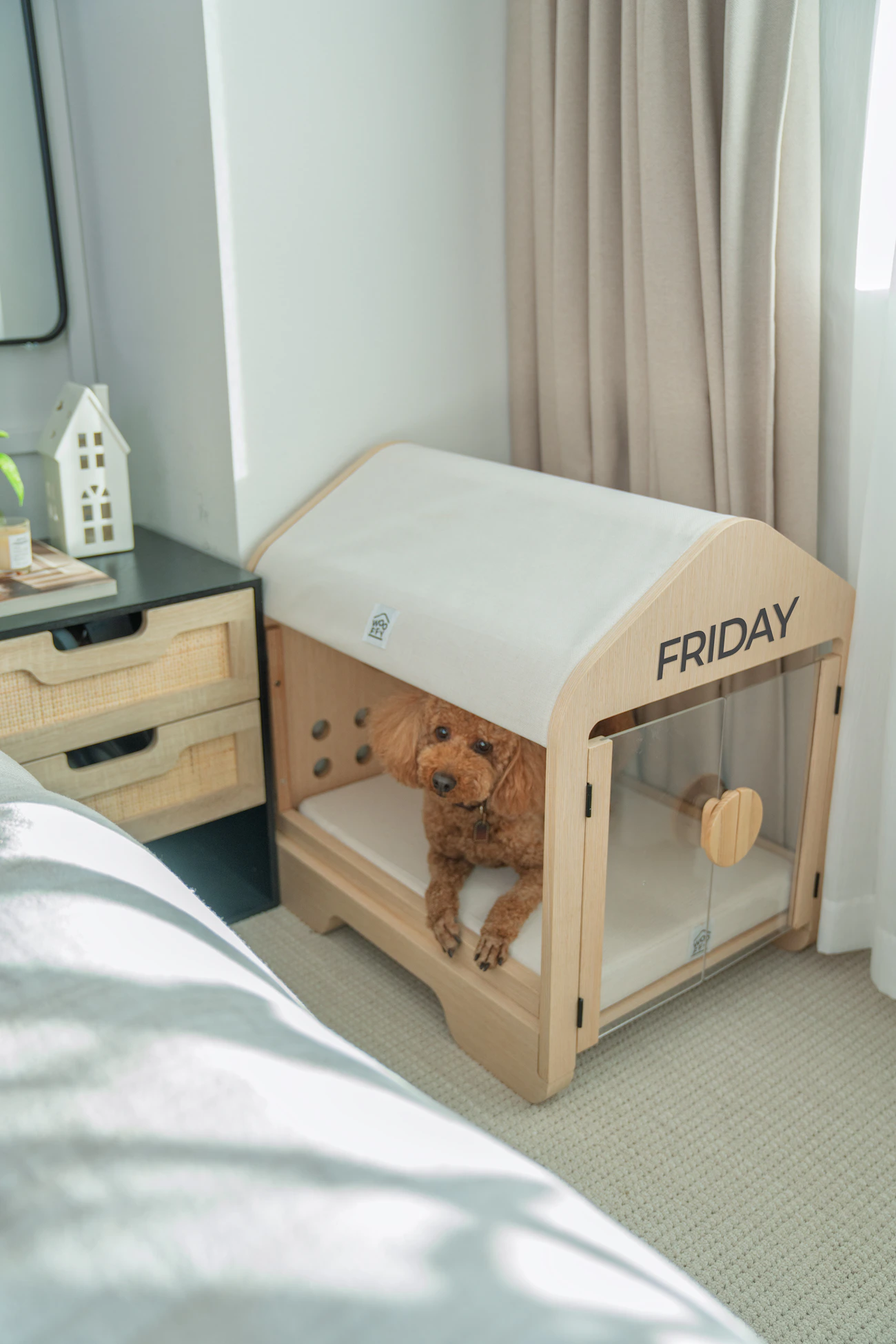 Dog resting inside a refined modern wooden pet space