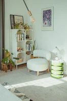 Cozy reading nook with plants and armchair.