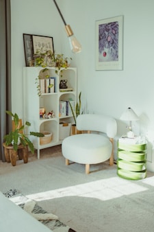 Cozy reading nook with plants and armchair.