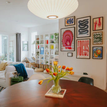 Living room with tulips and framed art